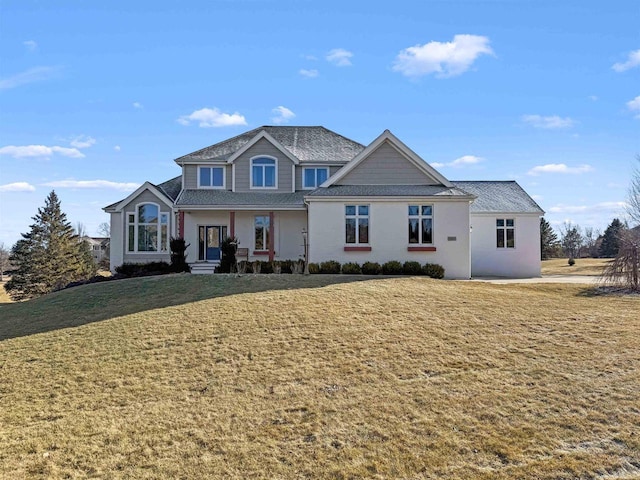 view of front of property with a front lawn