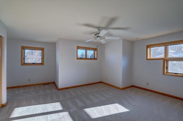 carpeted empty room with ceiling fan