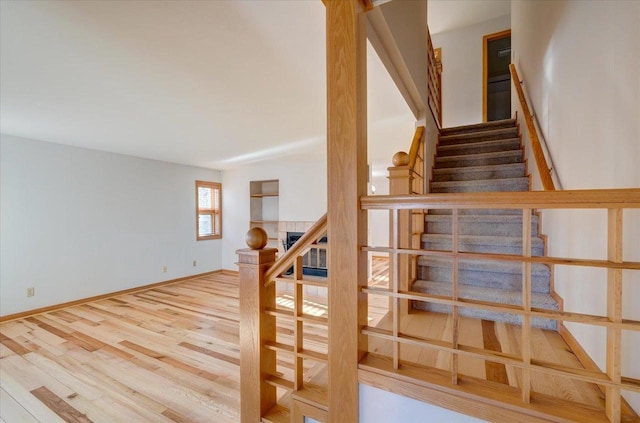 stairs with hardwood / wood-style flooring