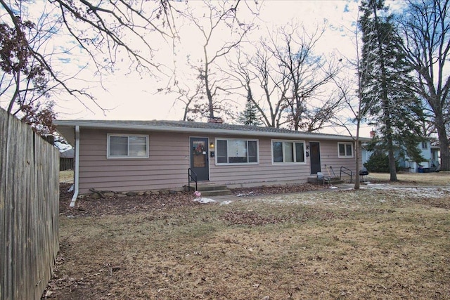 ranch-style home with a front yard