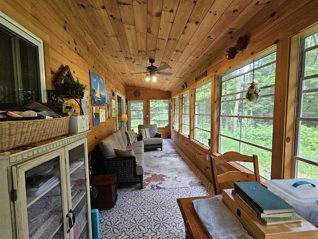 sunroom / solarium with wood ceiling, vaulted ceiling, and ceiling fan