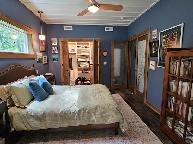 bedroom with ceiling fan and dark hardwood / wood-style floors