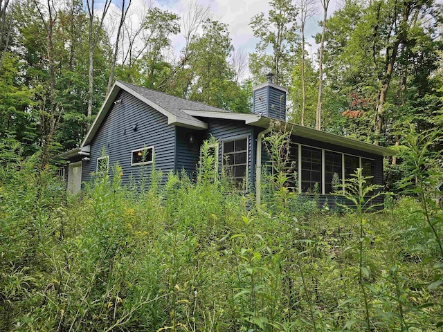 view of front of property featuring a sunroom