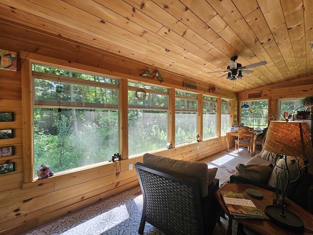 sunroom with ceiling fan, vaulted ceiling, and wooden ceiling