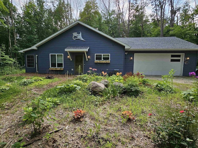 ranch-style house featuring a garage