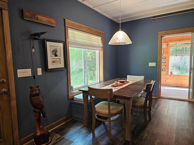 dining space featuring dark hardwood / wood-style flooring