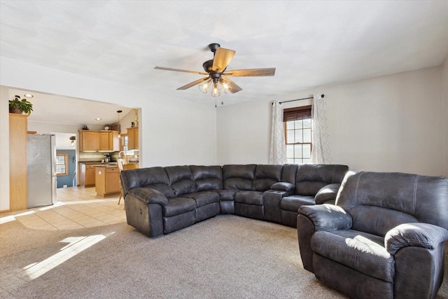 tiled living room featuring ceiling fan