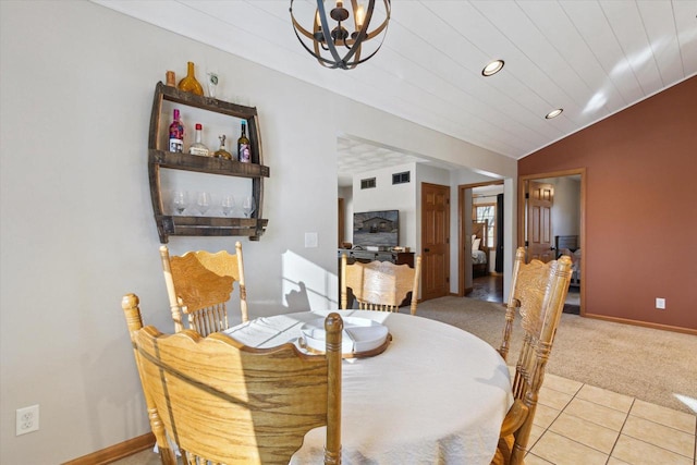 carpeted dining space featuring an inviting chandelier, wood ceiling, and lofted ceiling