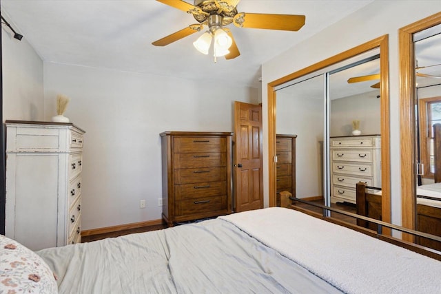 bedroom featuring ceiling fan and a closet