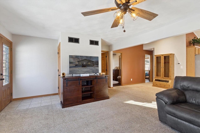 carpeted living room featuring ceiling fan