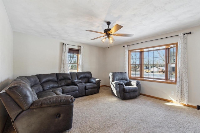 living room with light carpet and ceiling fan