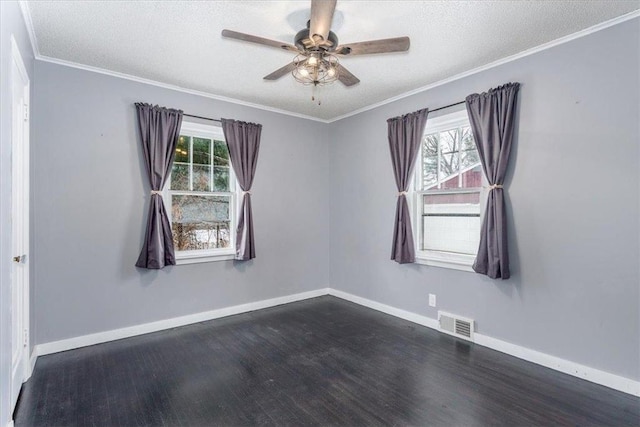 unfurnished room featuring crown molding, dark wood-type flooring, a wealth of natural light, and ceiling fan