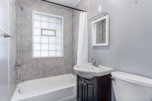 full bathroom featuring vanity, shower / tub combo, and toilet