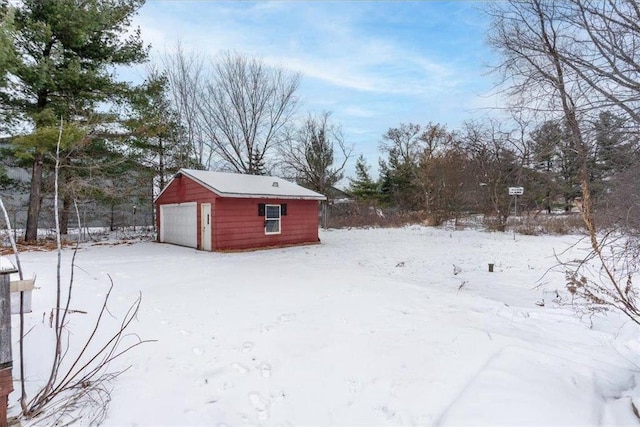 view of snow covered garage