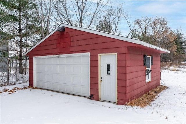 view of snow covered garage