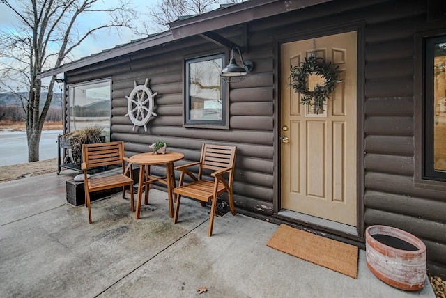 entrance to property with a patio area