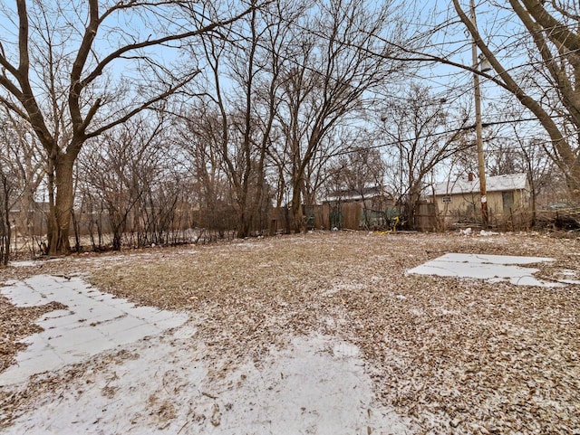 view of yard layered in snow