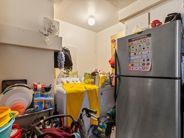 kitchen featuring stainless steel fridge and washer / dryer