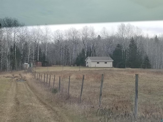 view of yard with a rural view