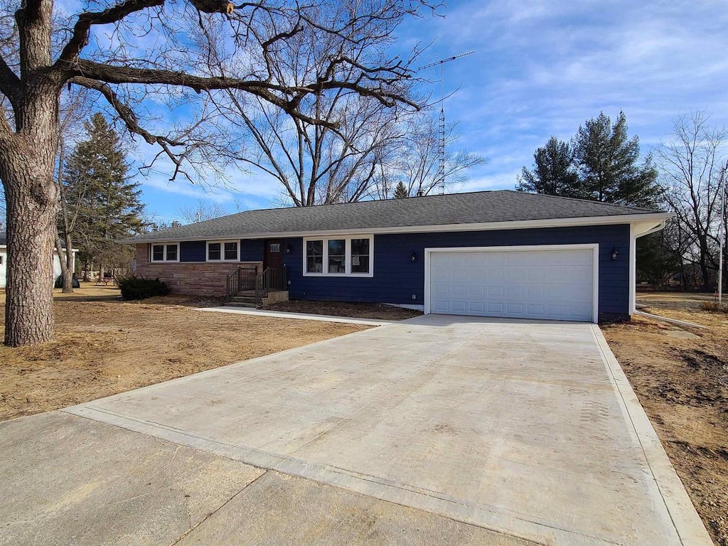 ranch-style home with a garage