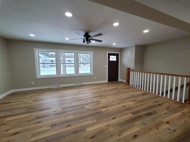 interior space with hardwood / wood-style flooring and ceiling fan