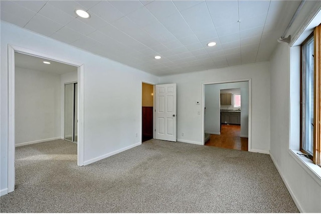 unfurnished bedroom with carpet floors