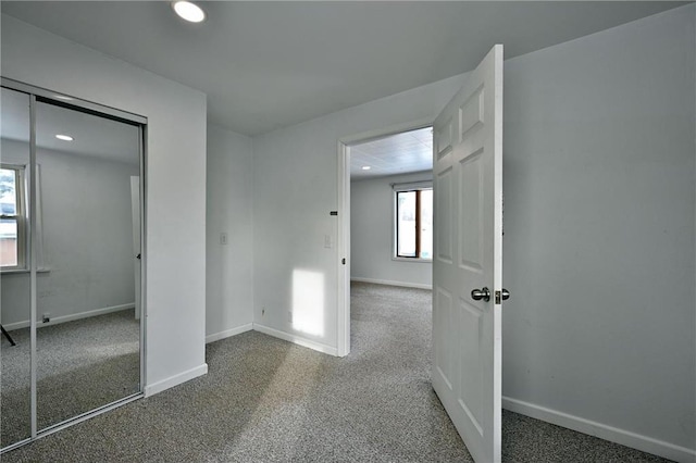 unfurnished room with carpet floors