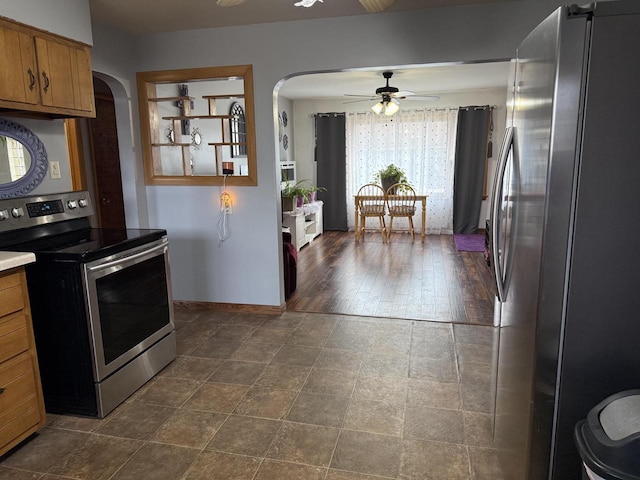 kitchen featuring ceiling fan and stainless steel appliances