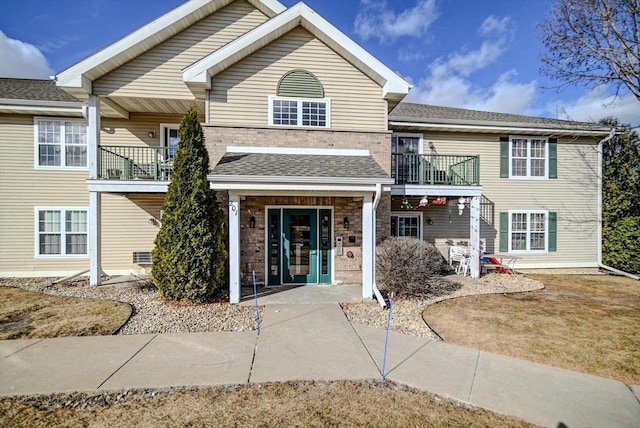 view of front of home with a balcony