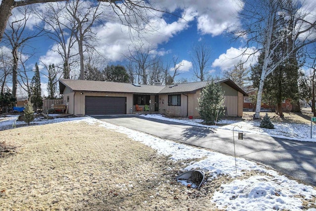 ranch-style house featuring a garage