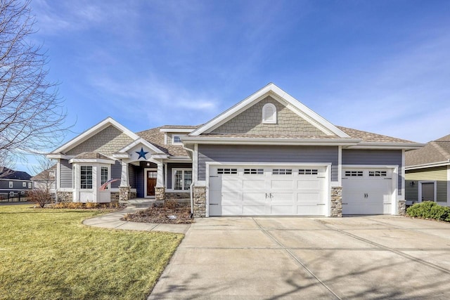 view of front of house featuring a garage and a front yard