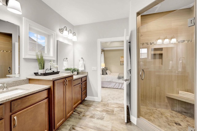 bathroom featuring vanity and an enclosed shower