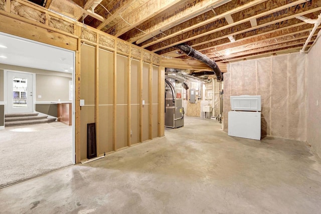 basement featuring heating unit