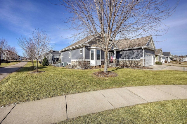 ranch-style house with a garage and a front yard