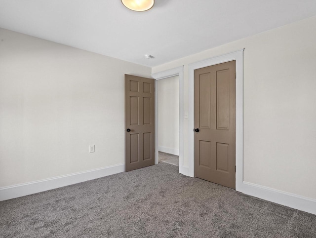 unfurnished bedroom with carpet