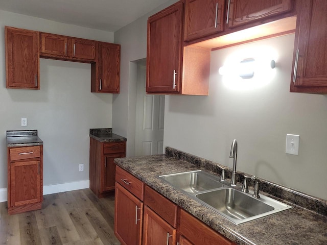 kitchen featuring hardwood / wood-style flooring and sink