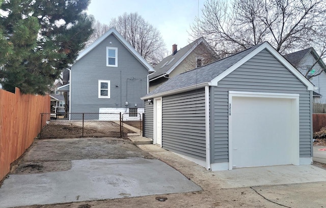 rear view of house with an outbuilding and a garage