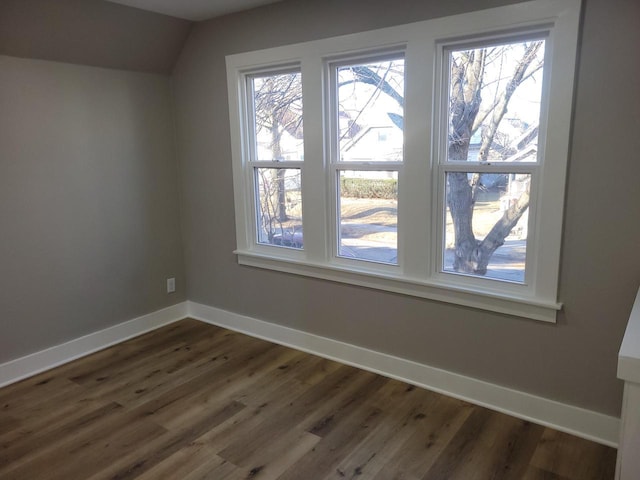 unfurnished room featuring dark hardwood / wood-style flooring