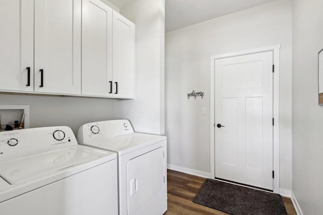 laundry room with cabinets, dark hardwood / wood-style flooring, and separate washer and dryer