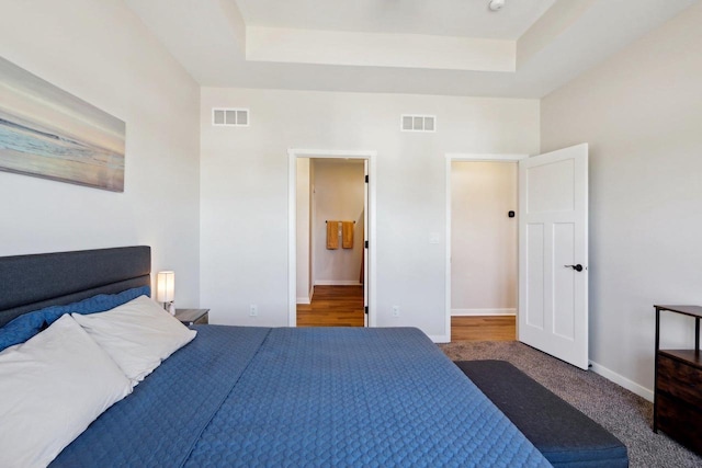 bedroom with a tray ceiling