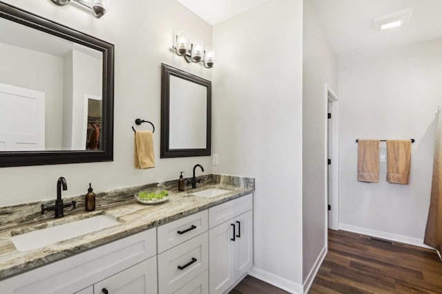 bathroom featuring vanity and hardwood / wood-style floors