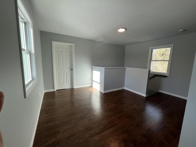 spare room featuring dark hardwood / wood-style flooring