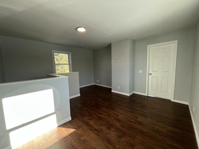 empty room featuring dark wood-type flooring