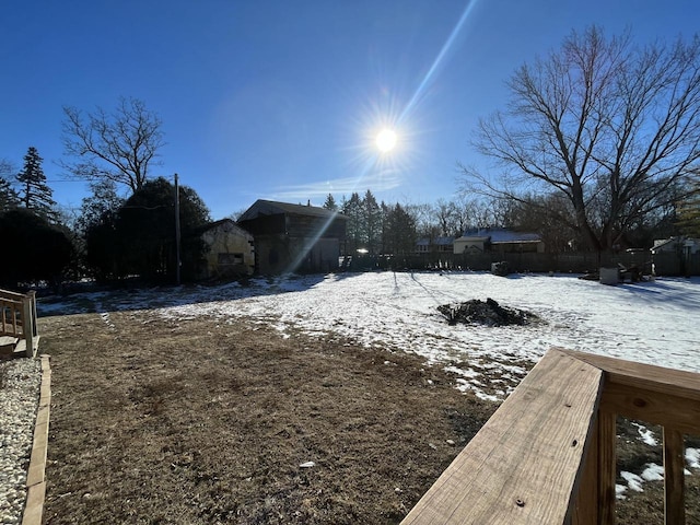 view of yard layered in snow