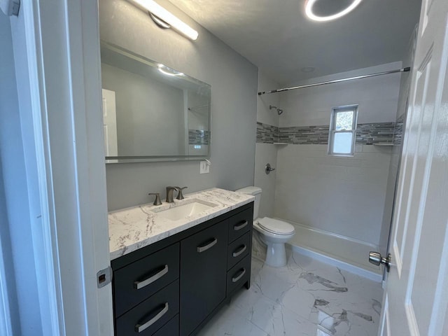 bathroom featuring vanity, toilet, and a tile shower