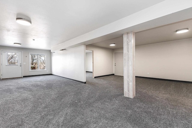 basement with dark carpet