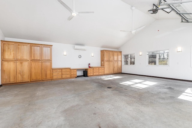 garage with ceiling fan, a garage door opener, and a wall unit AC