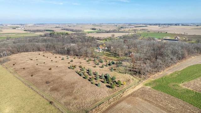 birds eye view of property with a rural view