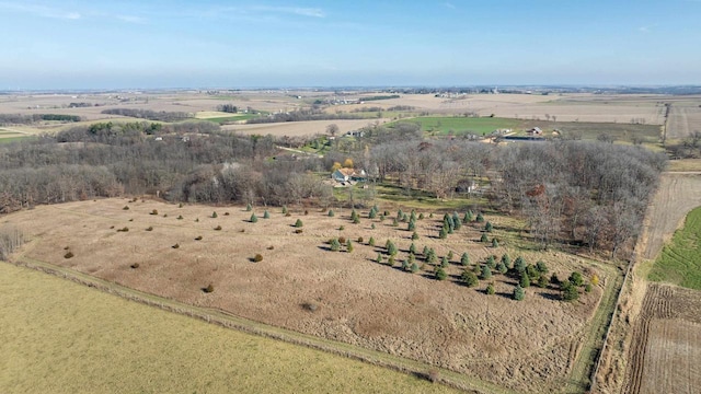 birds eye view of property featuring a rural view