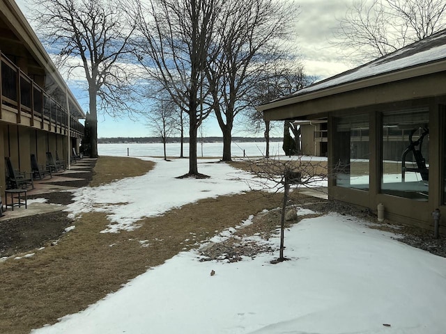 view of yard covered in snow